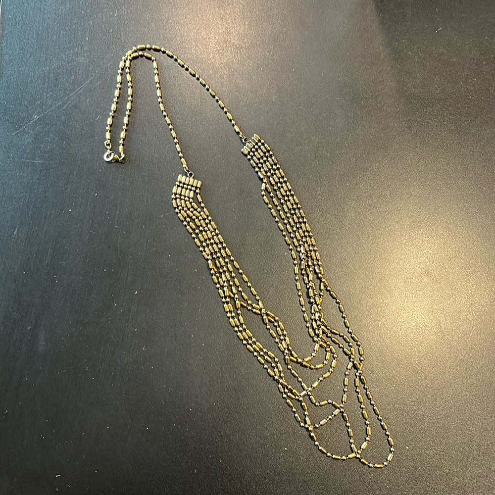 Bronze colored beaded necklace. 20” drop